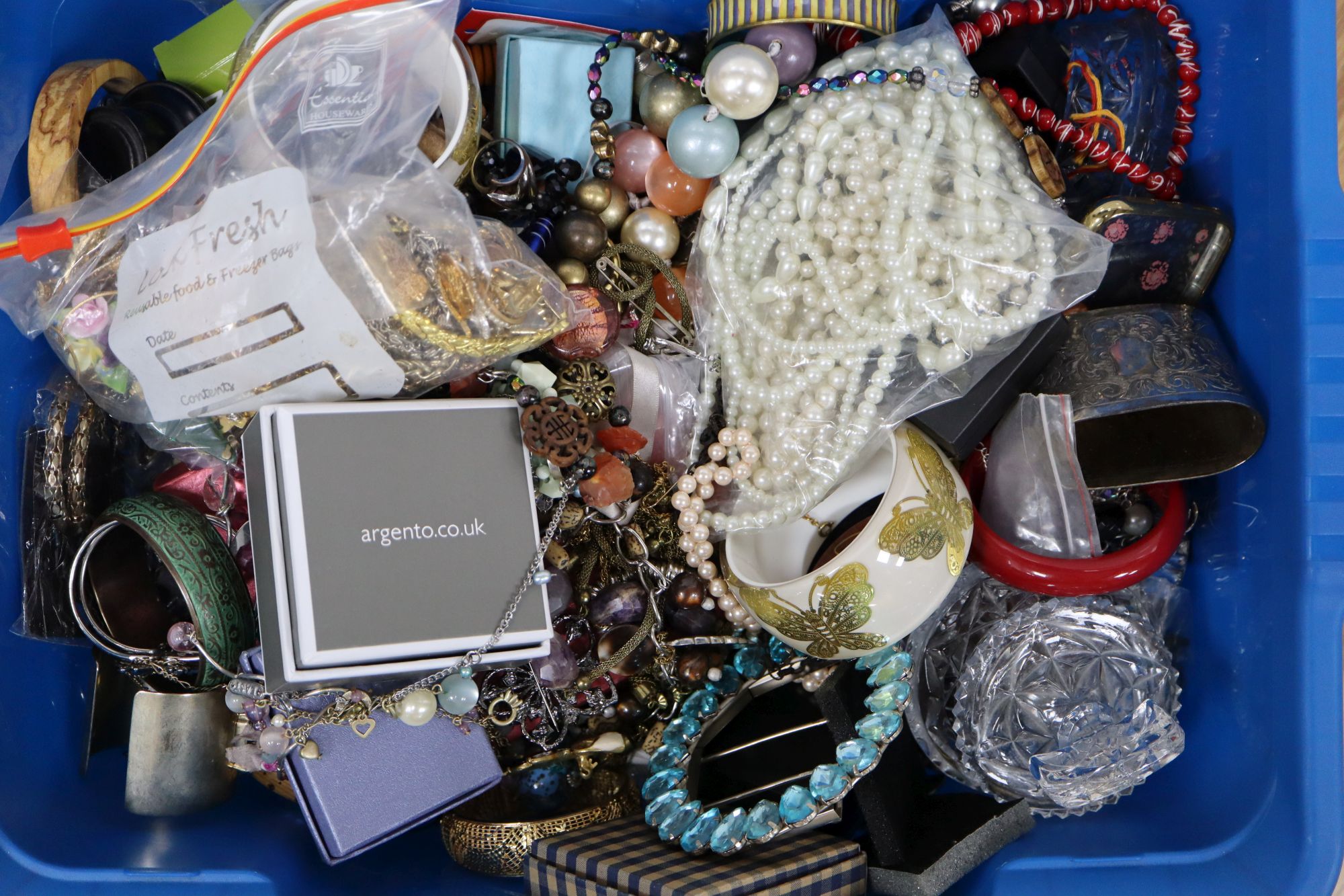 Two large boxes of assorted costume jewellery.